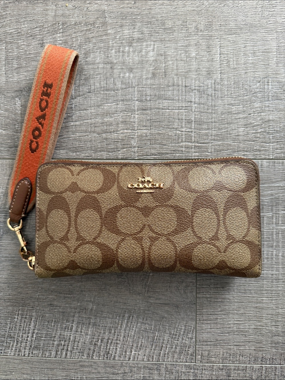 Coach Brown Signature Canvas Wristlet with Orange Strap